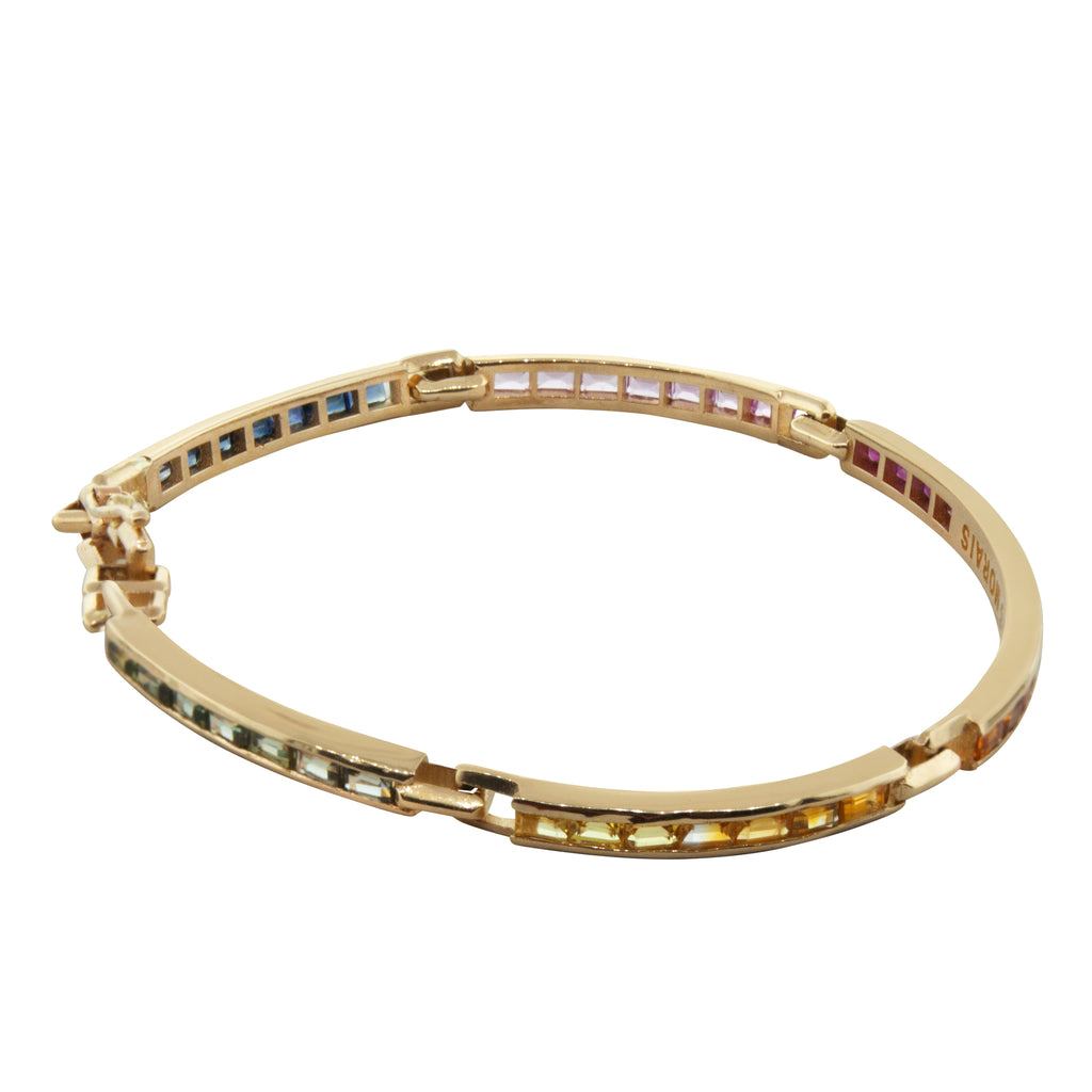 LUIS MORAIS 14k yellow gold long link ID bracelet featuring rainbow sapphire baguettes.  Approximately 4-5 carats of stones.