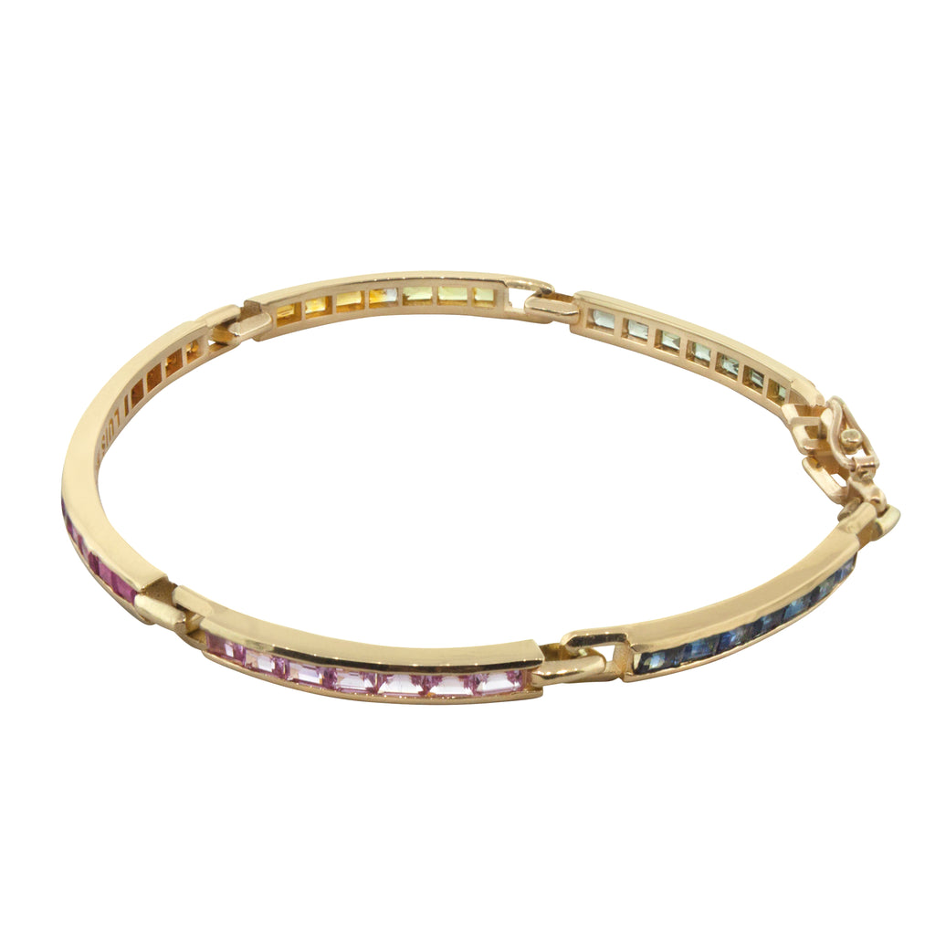 LUIS MORAIS 14k yellow gold long link ID bracelet featuring rainbow sapphire baguettes.  Approximately 4-5 carats of stones.