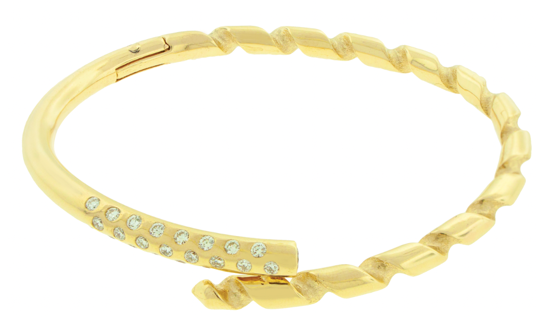 LUIS MORAIS 14k yellow gold drill bit bracelet with a white diamond accent on the end tip. iThe drill bit design is symbolic of digging deeper into oneself and life’s challenges. It represents resilience and the pursuit of discovery, encouraging the wearer to push through obstacles and uncover hidden truths.