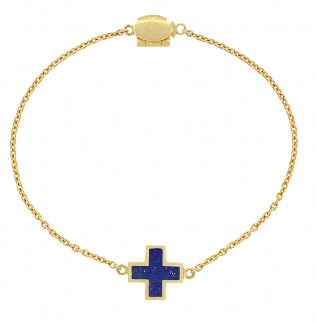 LUIS MORAIS 14k yellow gold cable chain bracelet with a gold framed cross and a clamshell clasp closure. The cross is a symbol of faith, hope, and spiritual strength. Representing protection and divine guidance, it serves as a timeless emblem of love, sacrifice, and connection to something greater.