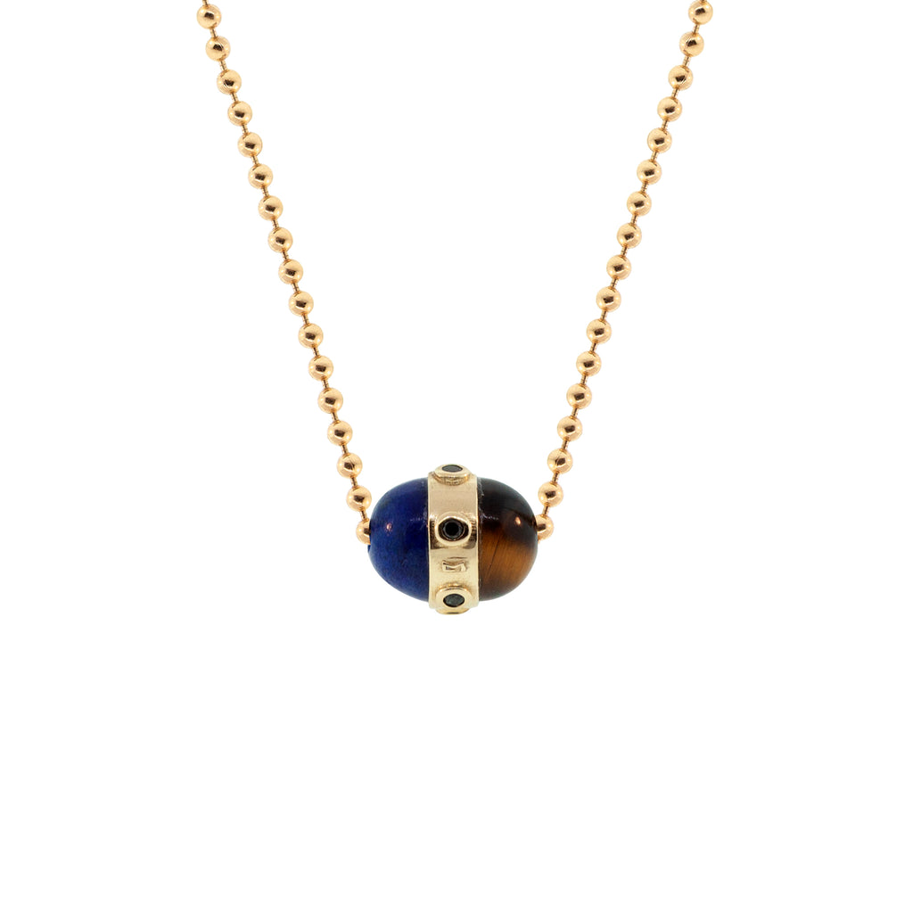 LUIS MORAIS 14K yellow gold vertical collar pendant with black diamond bezels and a lapis and tiger's eye cabochon on a 24 inch ball chain necklace. Lobster clasp closure.