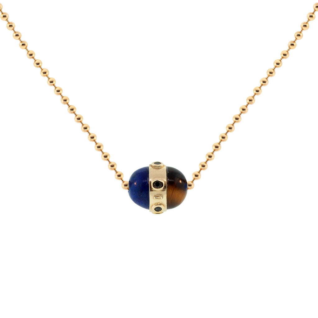 LUIS MORAIS 14K yellow gold vertical collar pendant with black diamond bezels and a lapis and tiger's eye cabochon on a 24 inch ball chain necklace. Lobster clasp closure.