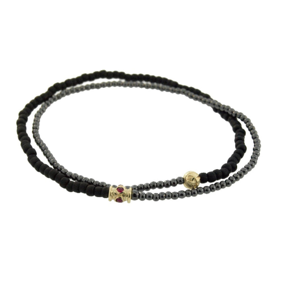 Black beaded bracelet on a white background
