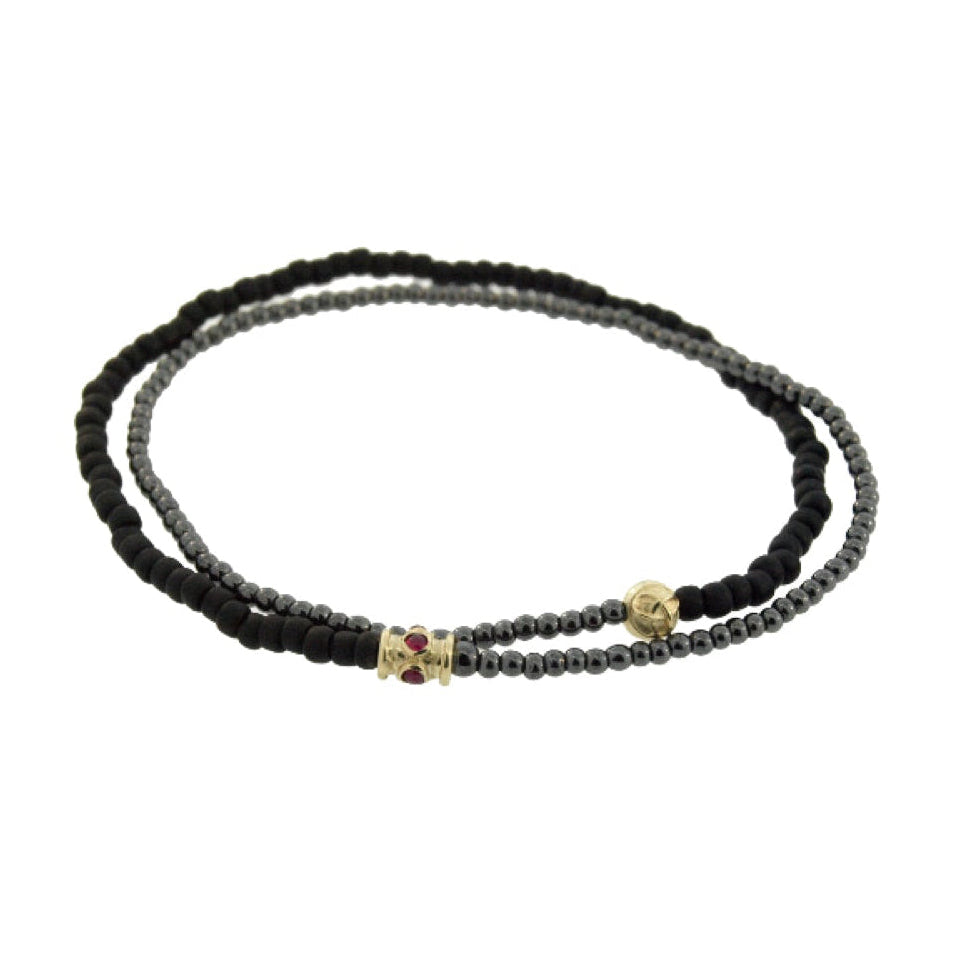 Black beaded bracelet on a white background