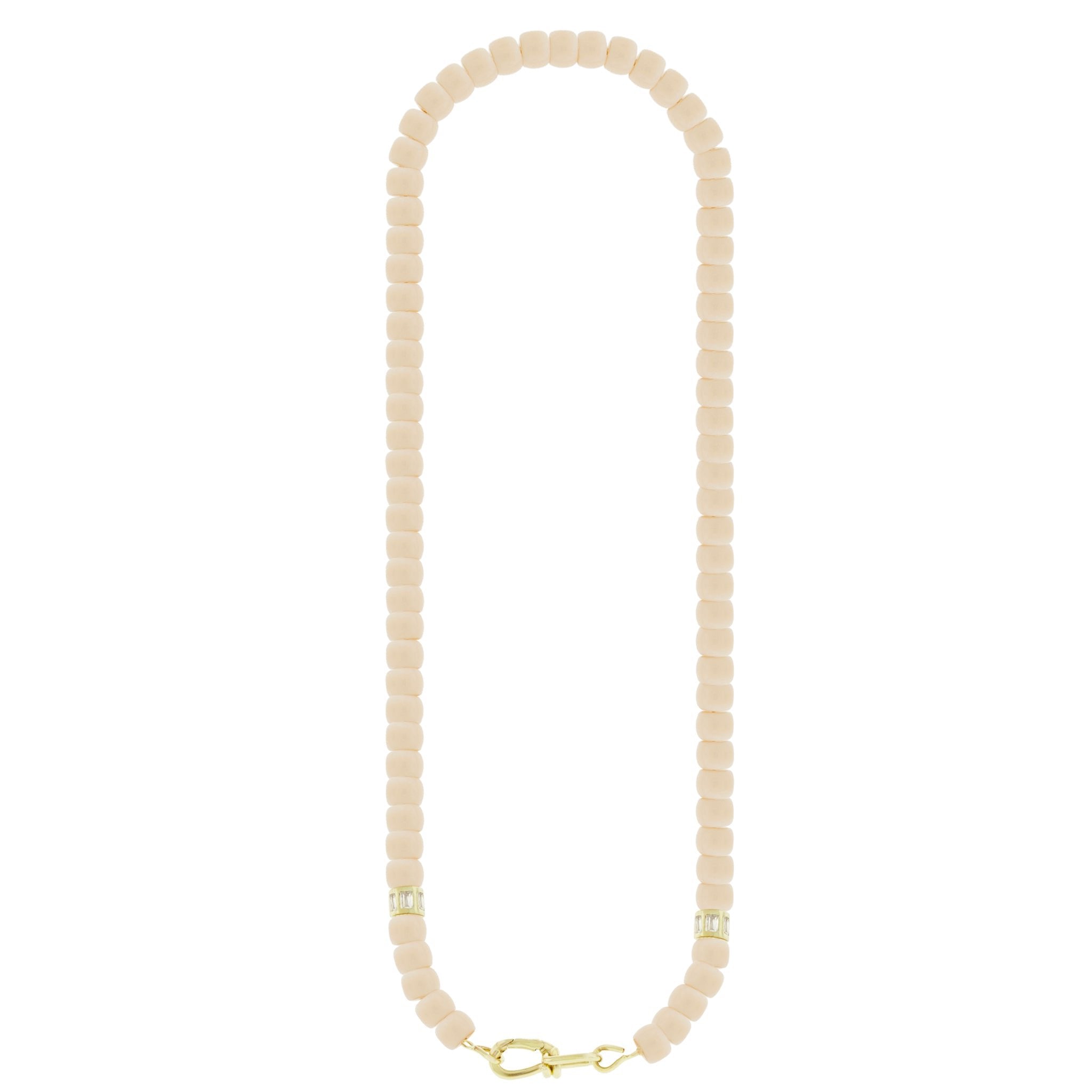 LUIS MORAIS 14k yellow gold wire clasp on a glass beaded necklace with two white diamond baguette barrels.