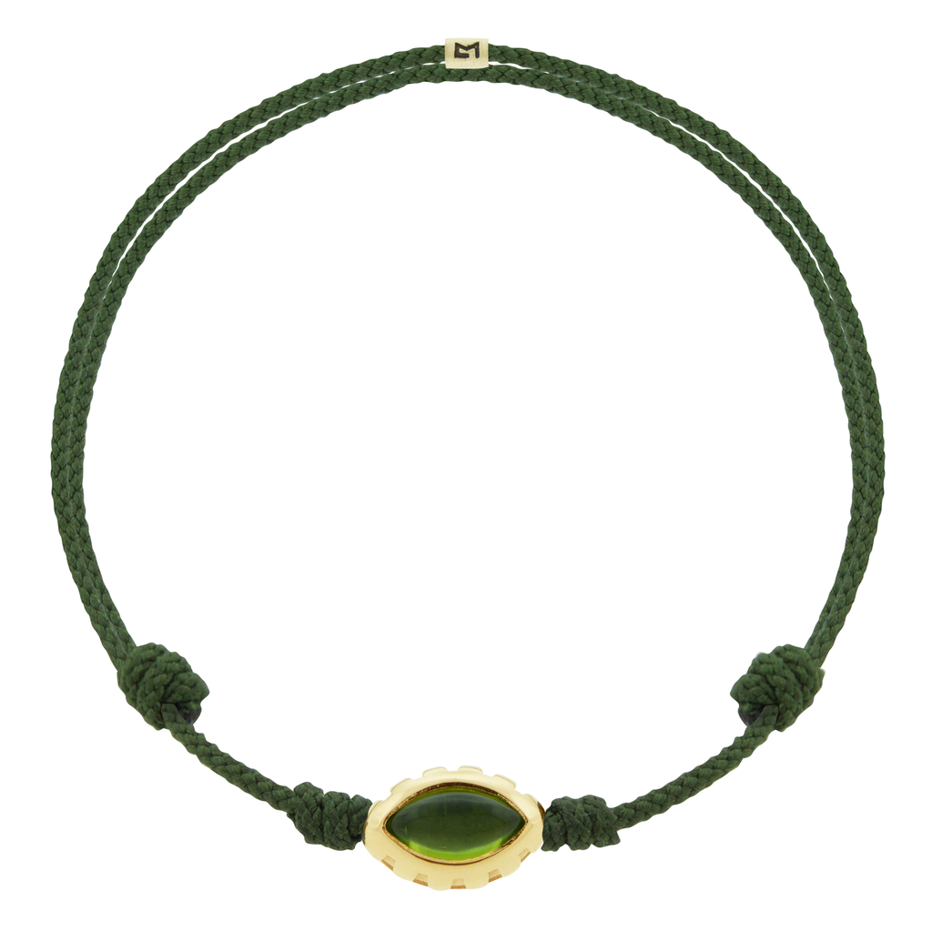 LUIS MORAIS 14k yellow gold Eye of the Idol bead with a marquise Peridot gemstone on a pine cord bracelet.