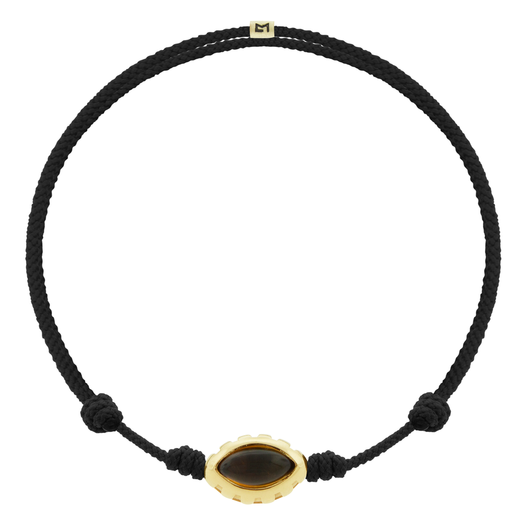 LUIS MORAIS 14k yellow gold Eye of the Idol bead with a marquise Citrine gemstone on a black cord bracelet.