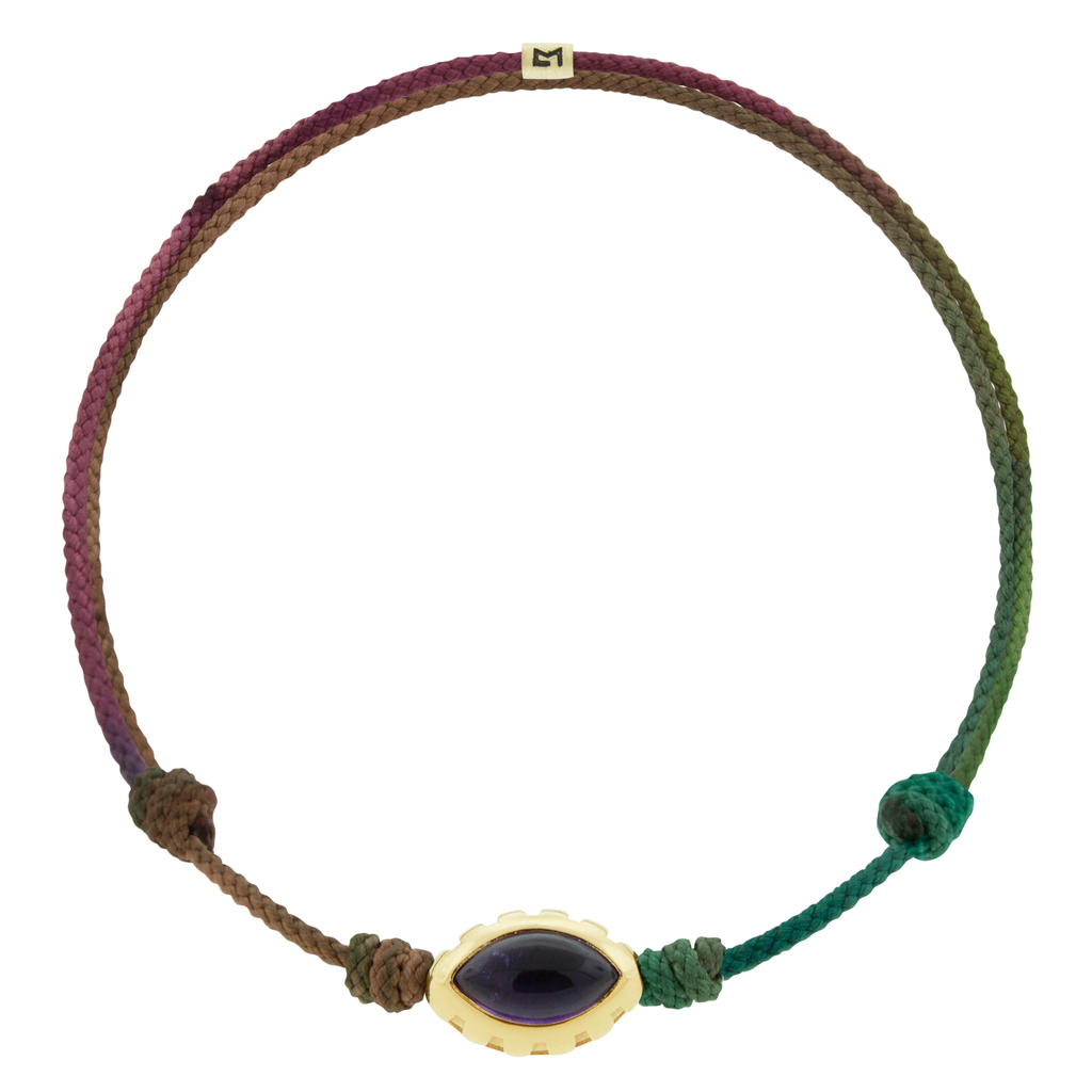 LUIS MORAIS 14k yellow gold Eye of the Idol bead with a marquise Amethyst gemstone on a Moody Rainbow cord bracelet.