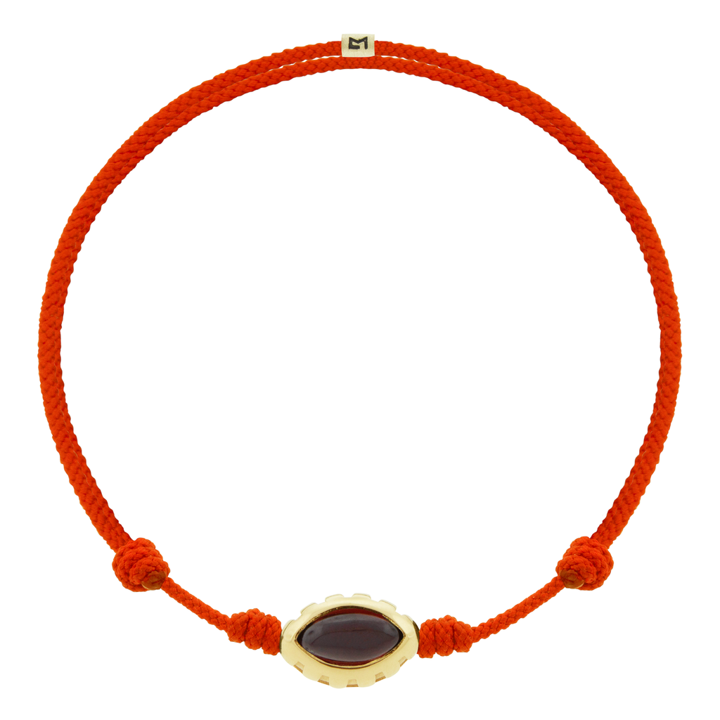 LUIS MORAIS 14k yellow gold Eye of the Idol bead with a marquise Garnet gemstone on a tomato cord bracelet.