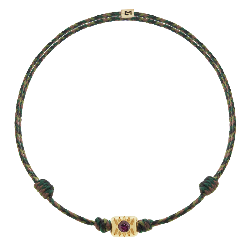 LUIS MORAIS 14k yellow gold eye ingot with a round Ruby&nbsp;center on an adjustable cord bracelet.