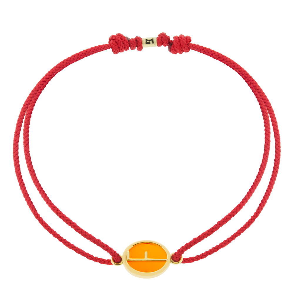 LUIS MORAIS 14k yellow gold large framed initial oval with a gemstone backing on a cord bracelet. Make this bracelet uniquely yours by choosing your initial, gemstone, and cord color below!