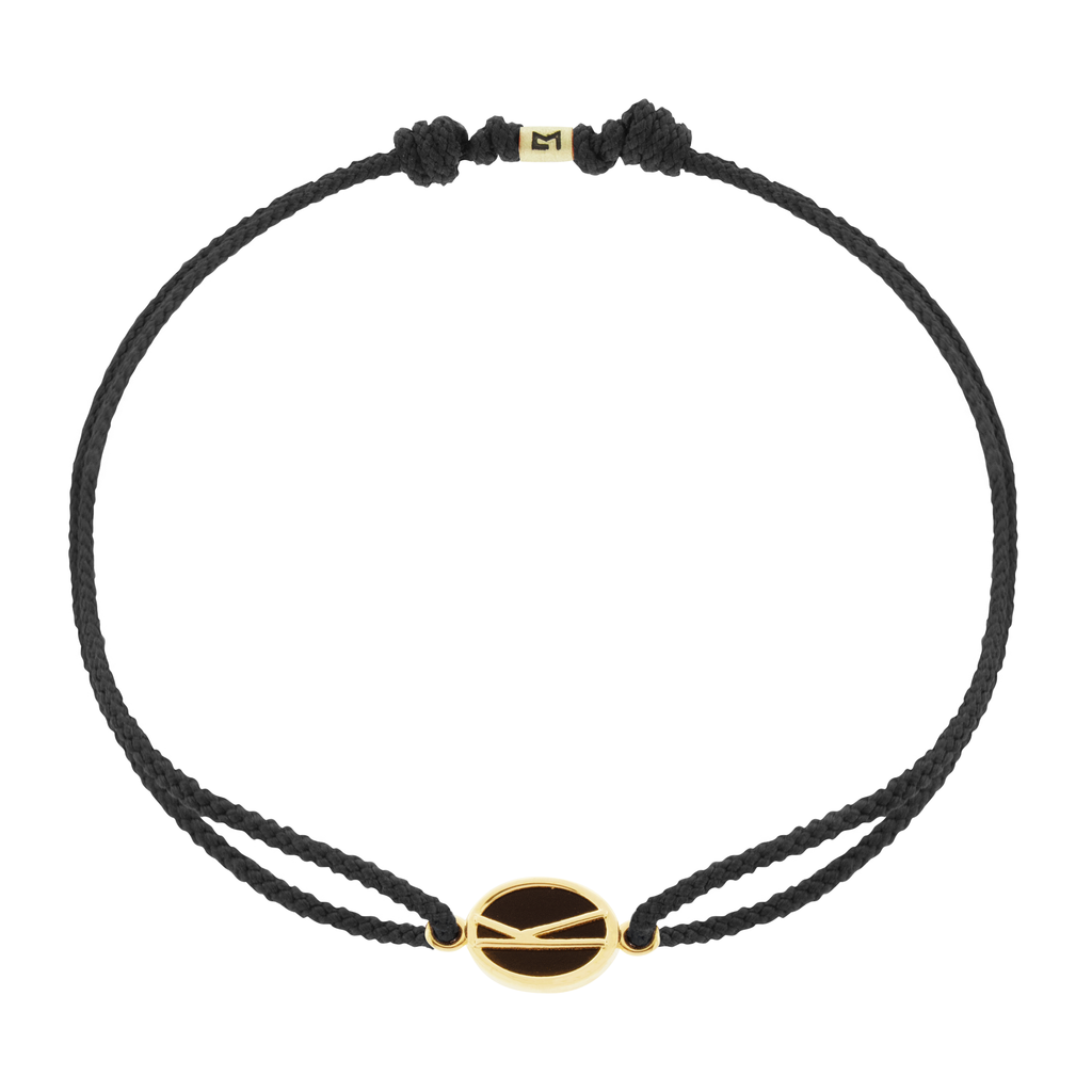 LUIS MORAIS 14k yellow gold large framed initial oval with a gemstone backing on a cord bracelet. Make this bracelet uniquely yours by choosing your initial and cord color below!