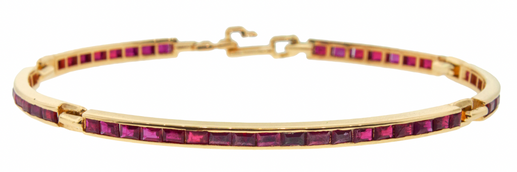 LUIS MORAIS 14k yellow gold long link ID bracelet featuring ruby baguettes.  Approximately 4-5 carats of stones.