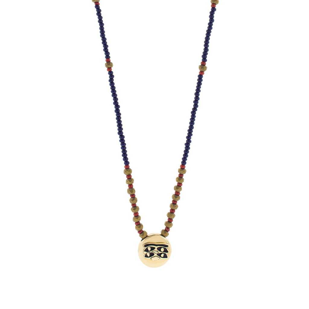 LUIS MORAIS 14k yellow gold large disk with blue enameled Horus Eyes symbol on a 27 inch beaded necklace. Features gold logo spacer.