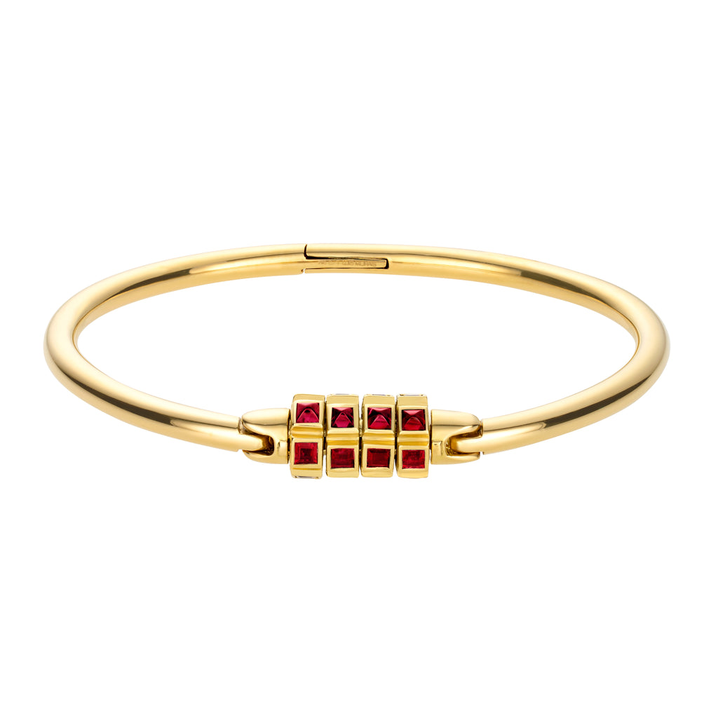 18k Yellow Gold Combination Lock Bracelet with Rubies  As seen in Harper's Bazaar Italia:  'A combination lock dressed in rubies characterizes this particular rigid bracelet in yellow gold proposed by Luis Morais. Wearable from morning to evening, it can be combined with the most diverse looks.'