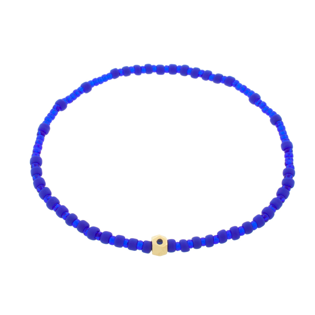 LUIS MORAIS 14K Yellow Gold Flat Tetra with a Blue Sapphire on a Blue Glass Beaded Bracelet