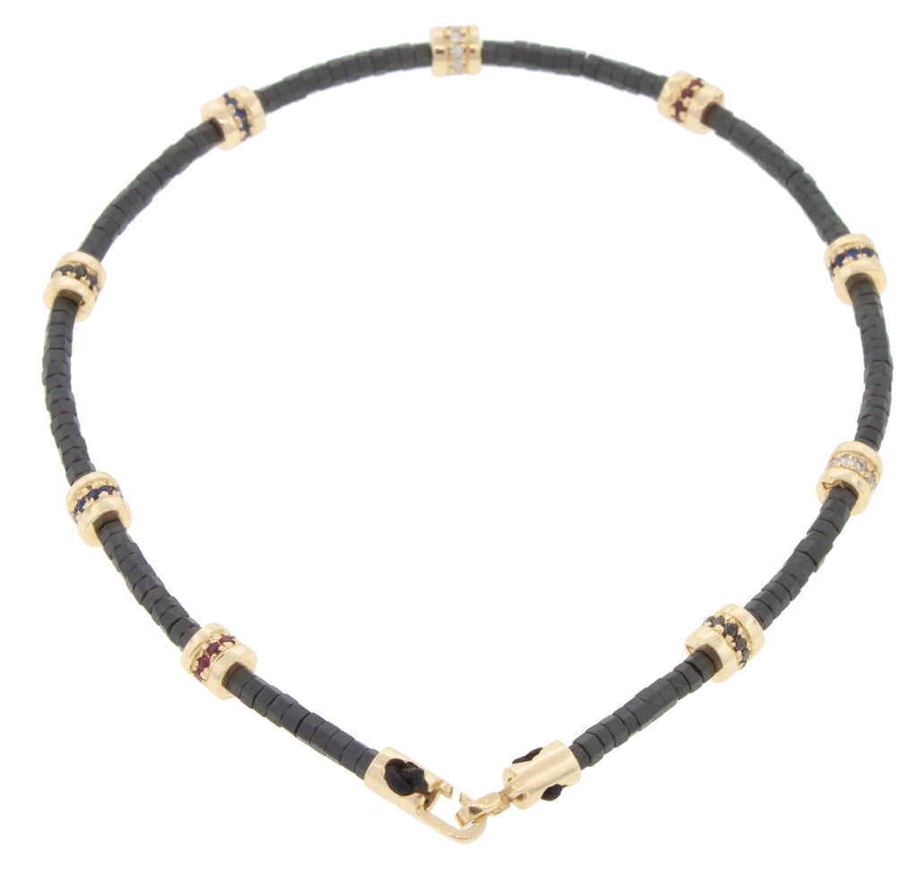 Nine Short Roll Beads with Diamonds and a Clasp on a Beaded Bracelet