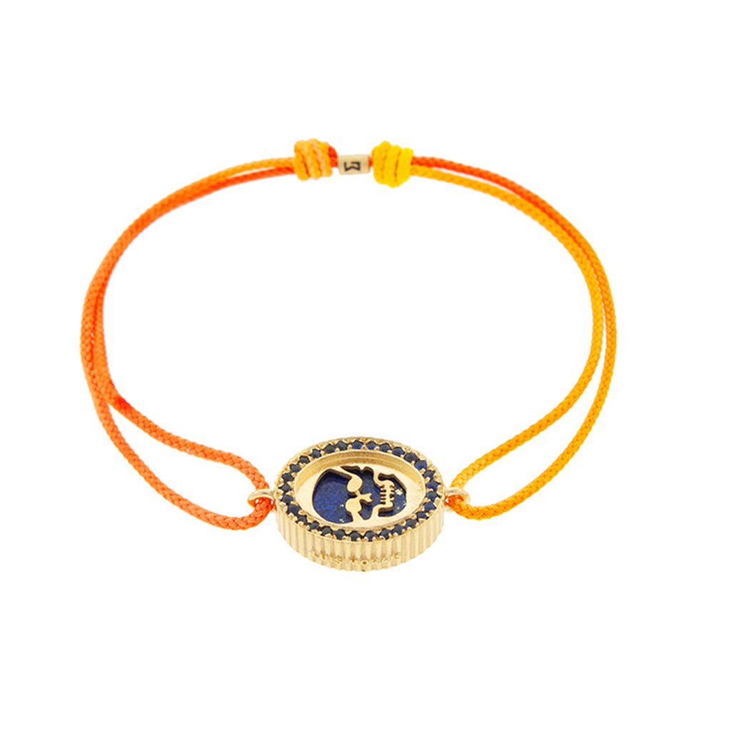 LUIS MORAIS 14K yellow gold 'The Good Times' Skull Medallion surrounded by blue sapphires with a lapis gemstone backing on a yellow ombre cord bracelet