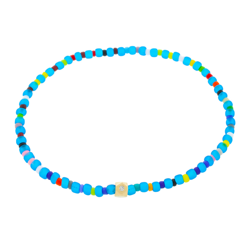 LUIS MORAIS 14K Yellow Gold Flat Tetra with a Blue Sapphire on a Yellow and Multi Color Glass Beaded Bracelet