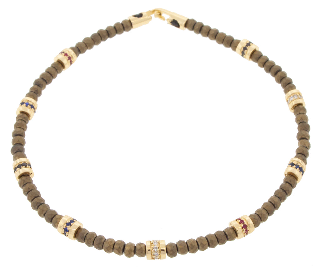 Nine Short Roll Beads with Diamonds and a Clasp on a Beaded Bracelet