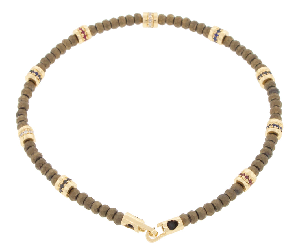 Nine Short Roll Beads with Diamonds and a Clasp on a Beaded Bracelet
