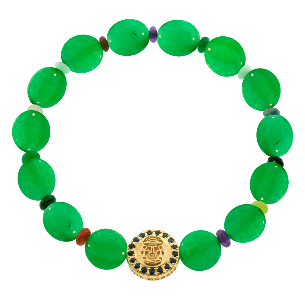 LUIS MORAIS 14K yellow gold large disk with a good luck symbol surrounded by blue sapphires on a large green chalcedony disk and small round multi gemstone beaded bracelet. The symbol and diamonds are on both sides of the gold.