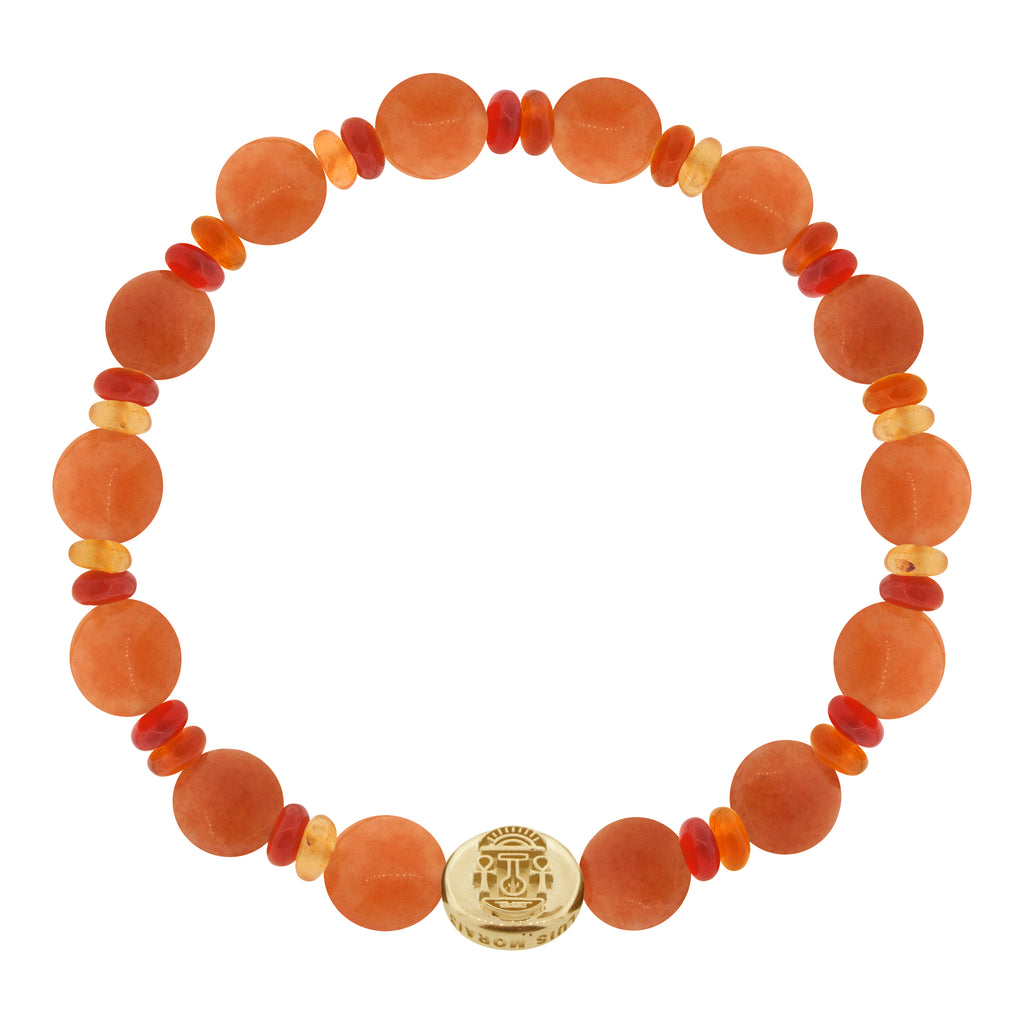 LUIS MORAIS 14K yellow gold small disk with a good luck symbol on medium orange carnelian disks and roundel beads on a beaded bracelet. The symbol is on both sides of the gold.