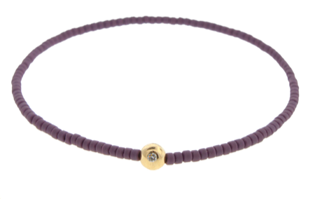 Boule d'or avec diamant blanc sur bracelet de perles de verre