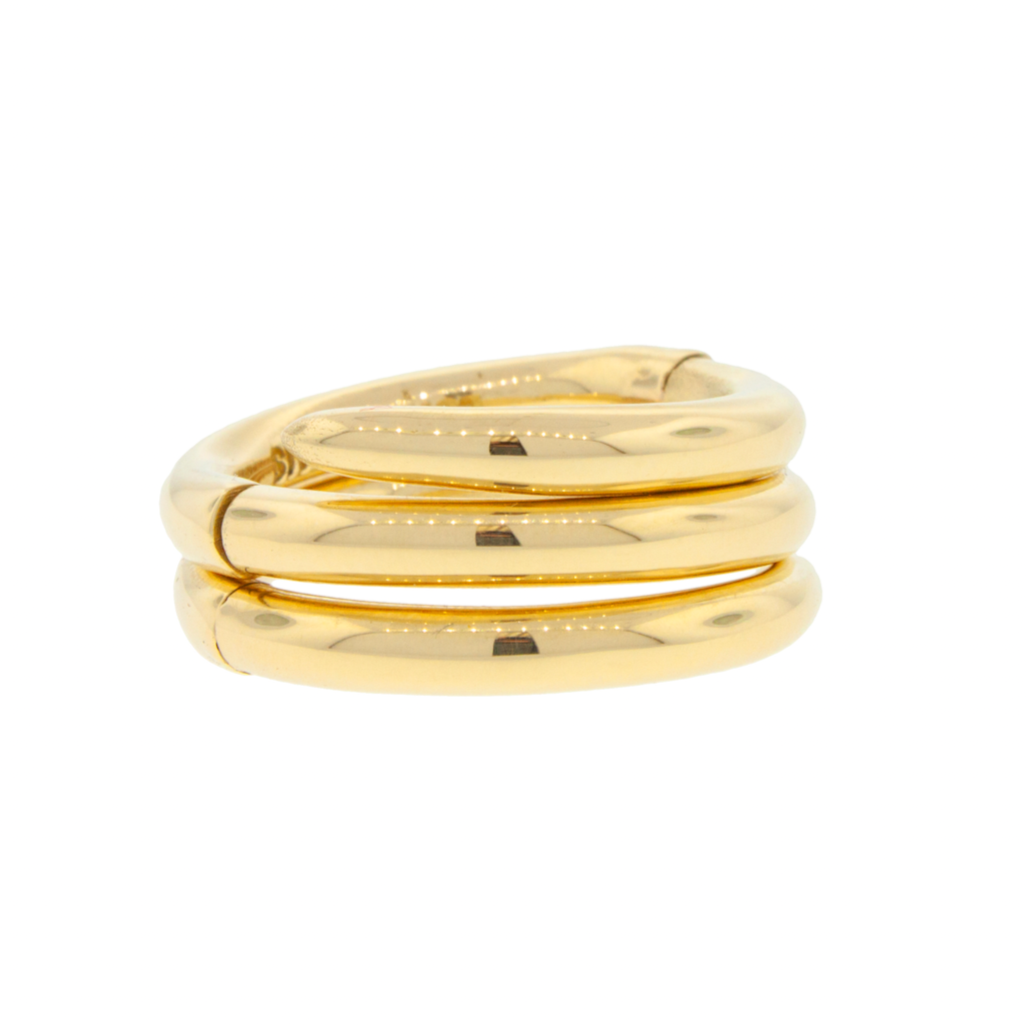 Gold ring with three intertwined bands on a white background