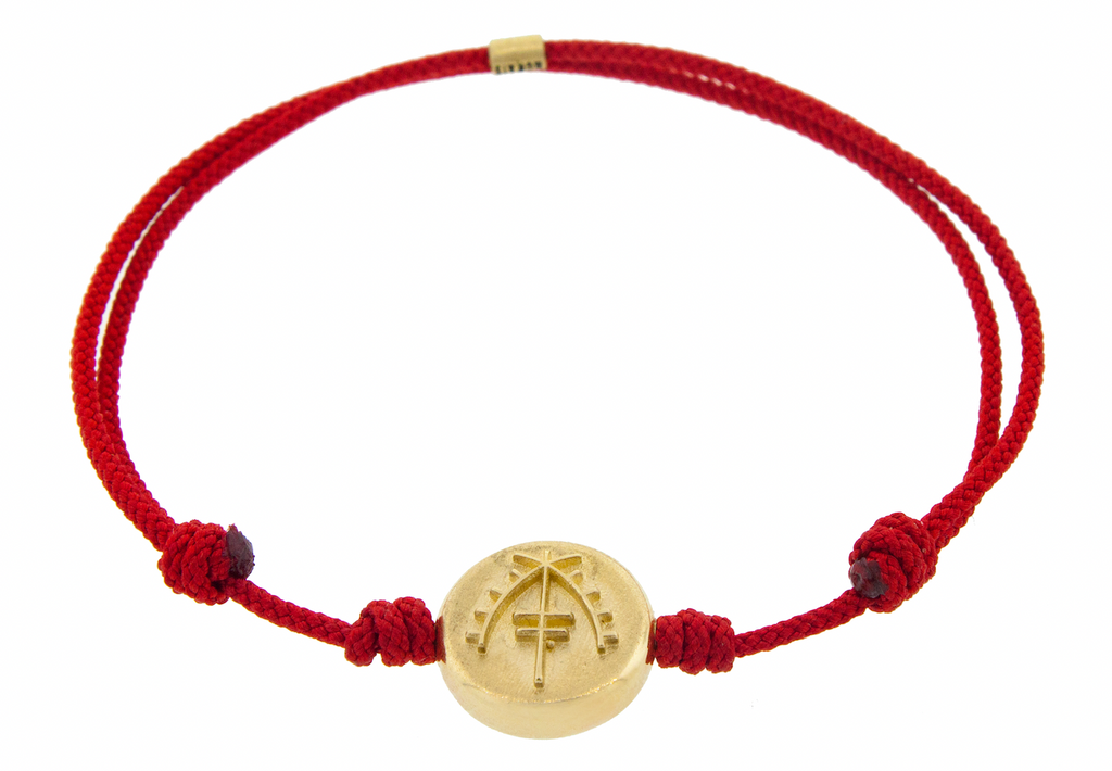 LUIS MORAIS 14K yellow gold large Moor disk on a red cord bracelet. 