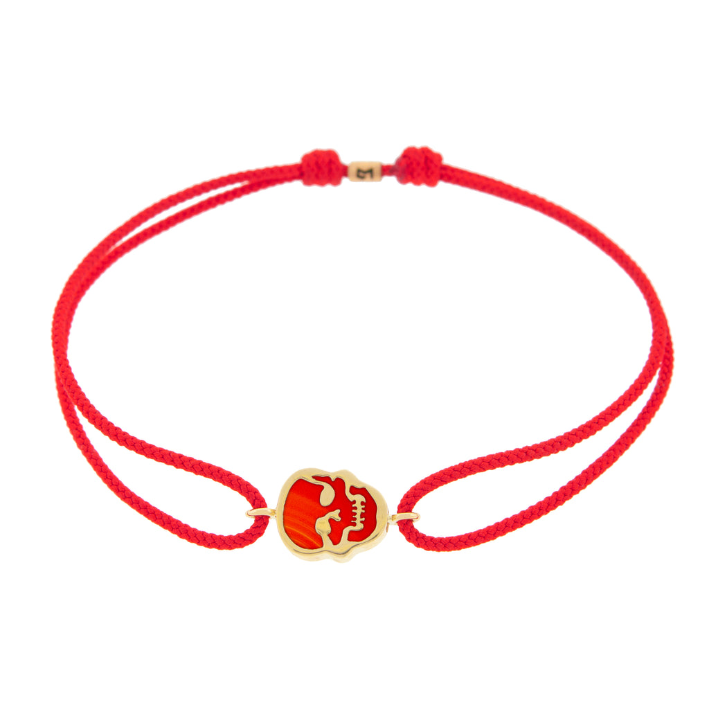 LUIS MORAIS 14K yellow gold 'The Good Times' small skull face medallion with a carnelian gemstone backing on a cherry cord bracelet