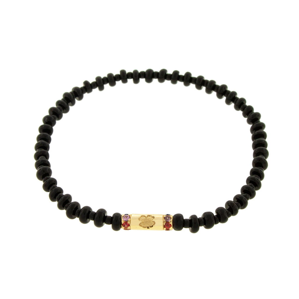 LUIS MORAIS 14K yellow gold slim tube with a clover symbol and two channels of rainbow sapphires on an onyx and glass beaded bracelet