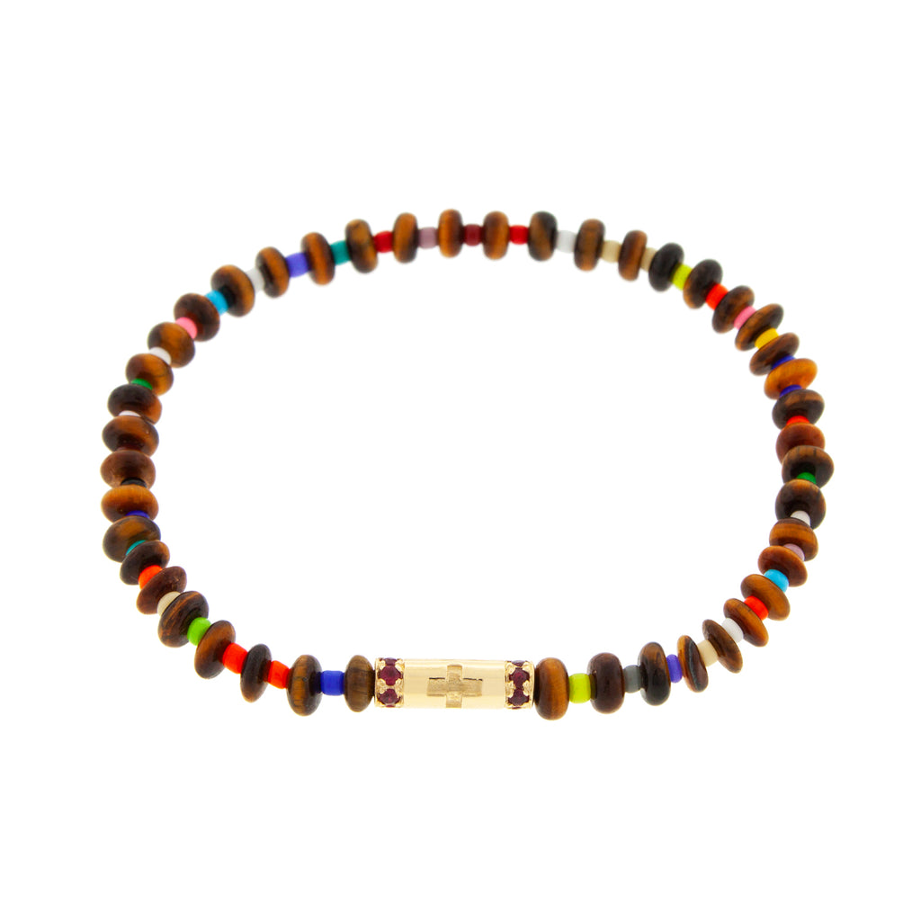 LUIS MORAIS 14K yellow gold slim tube with a cross symbol and two channels of rubies on a tiger's eye and glass beaded bracelet