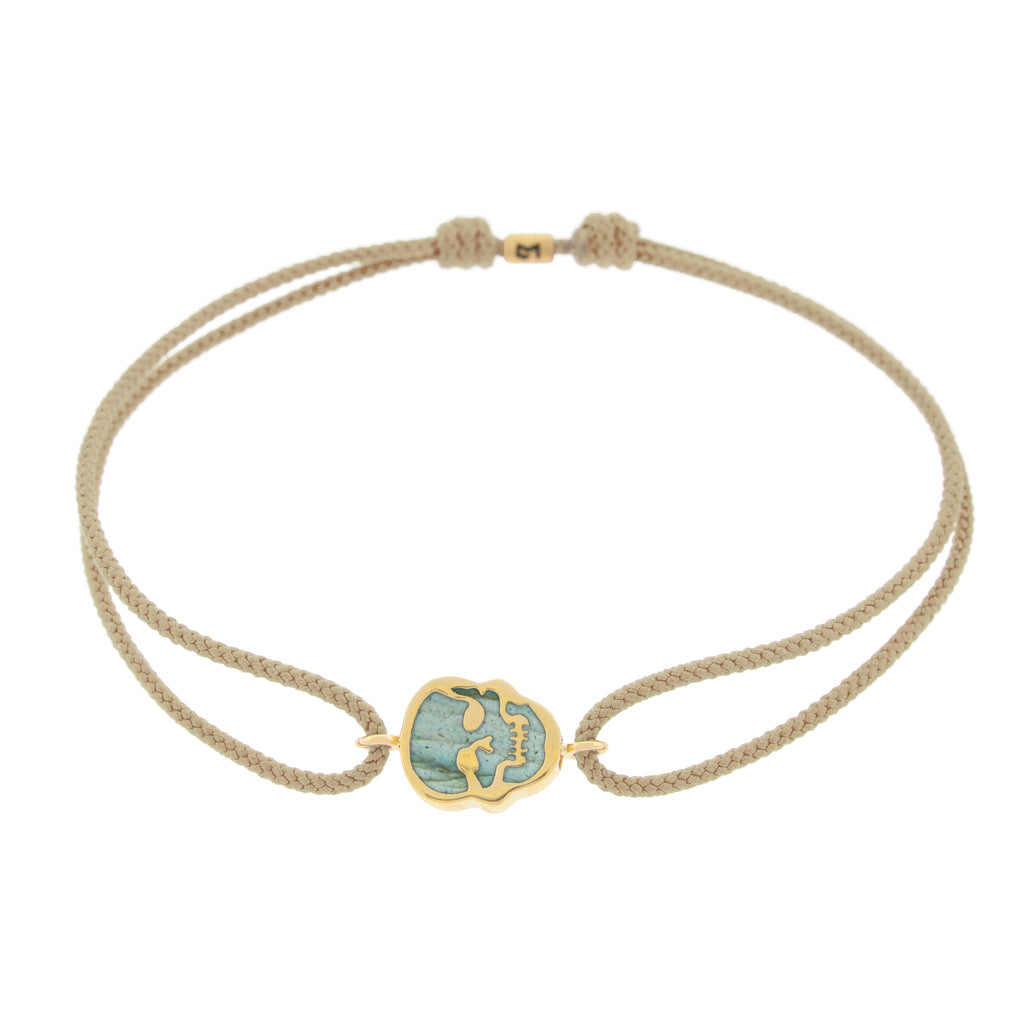 LUIS MORAIS 14K yellow gold 'The Good Times' small skull face medallion with a labradorite gemstone backing on a taupe cord bracelet