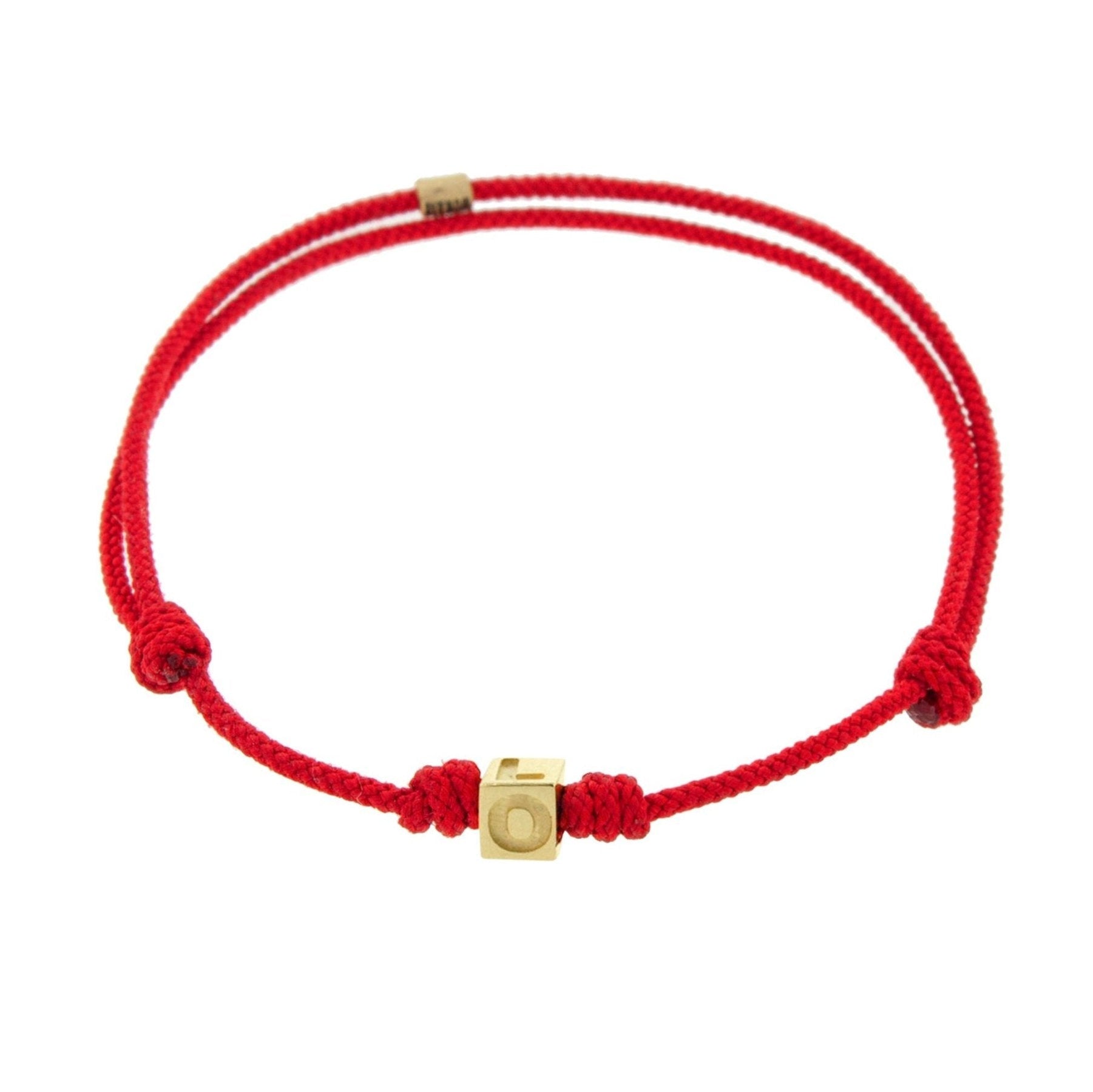 LUIS MORAIS 14k yellow gold cube on an adjustable cord bracelet. Gold logo spacer.