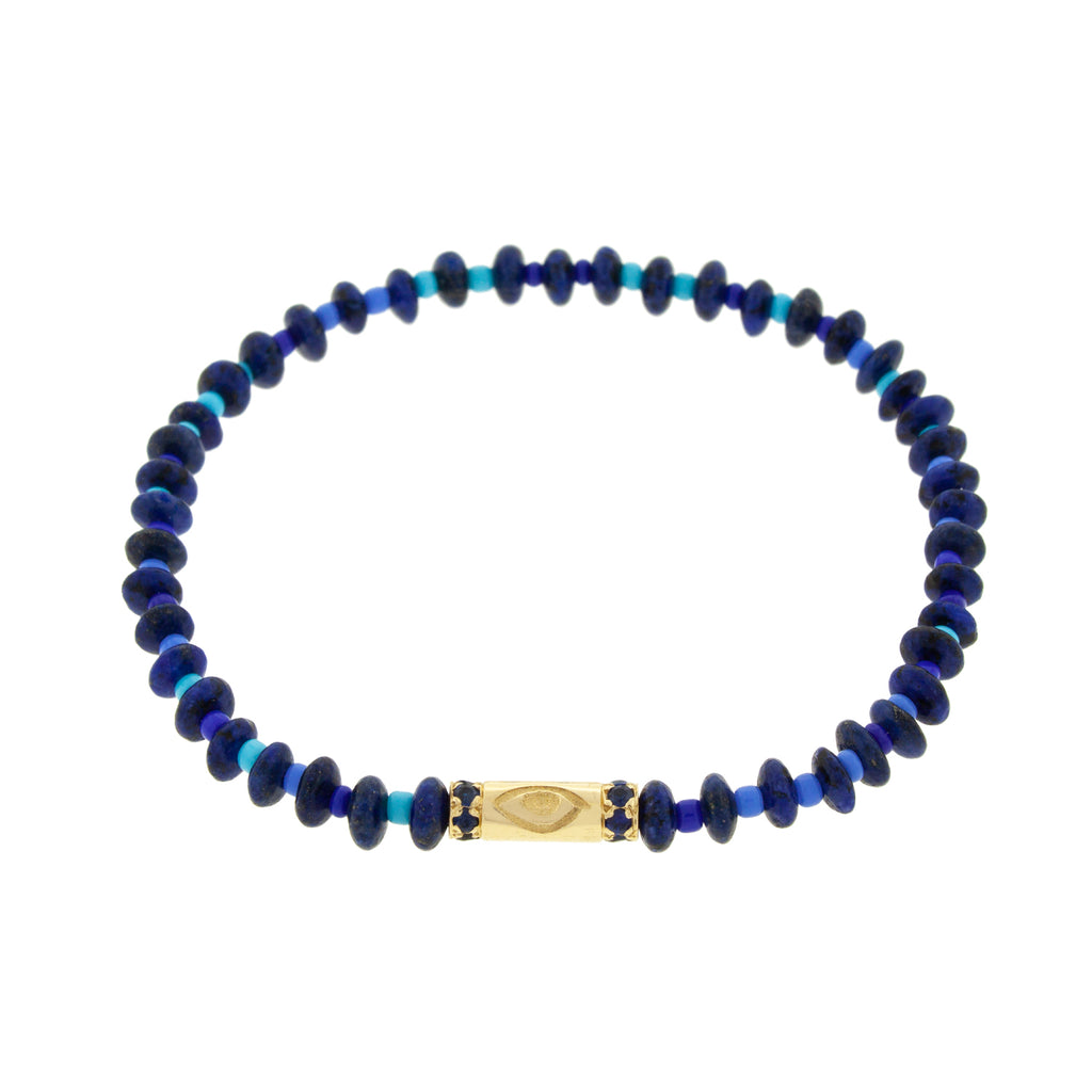 LUIS MORAIS 14K yellow gold slim tube with an evil eye symbol and two channels of blue sapphires on a lapis and glass beaded bracelet