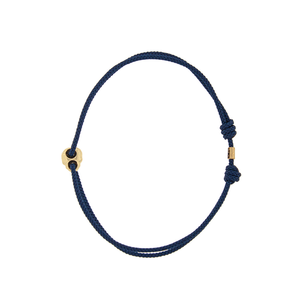 Yellow Gold Small Skull Outline on a Navy Cord Bracelet