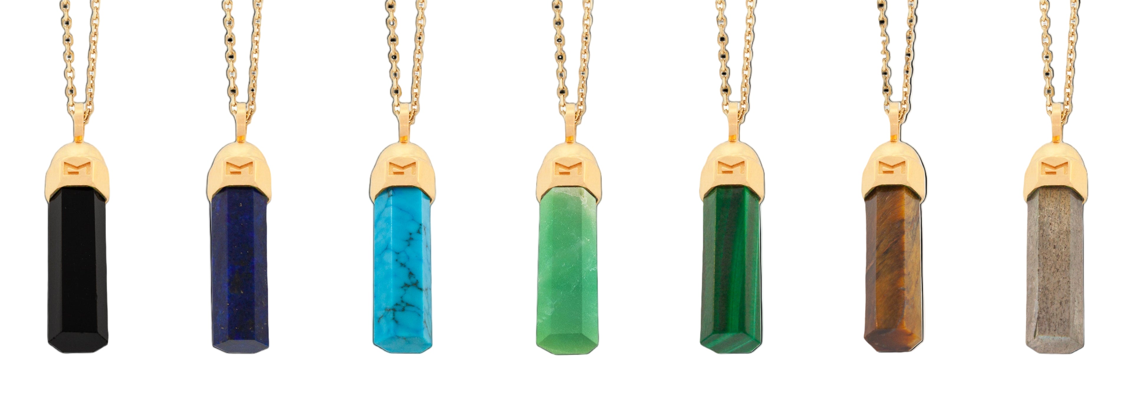 Row of gemstone necklaces with gold pendants on a white background