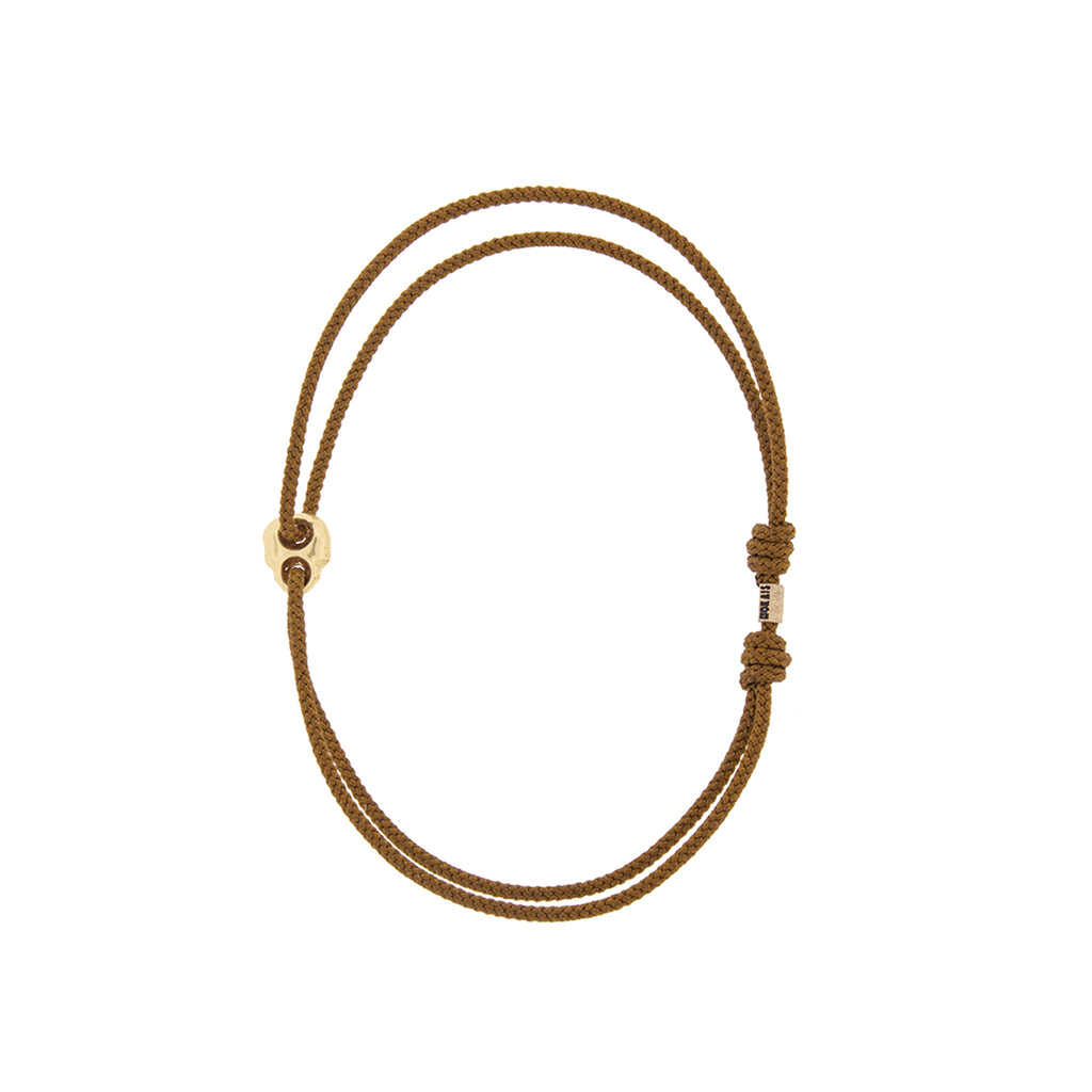 Yellow Gold Small Skull Outline on a Olive Cord Bracelet