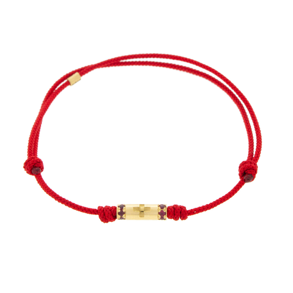 LUIS MORAIS 14K yellow gold slim tube with a cross symbol and two channels of rubies on a red cord bracelet 