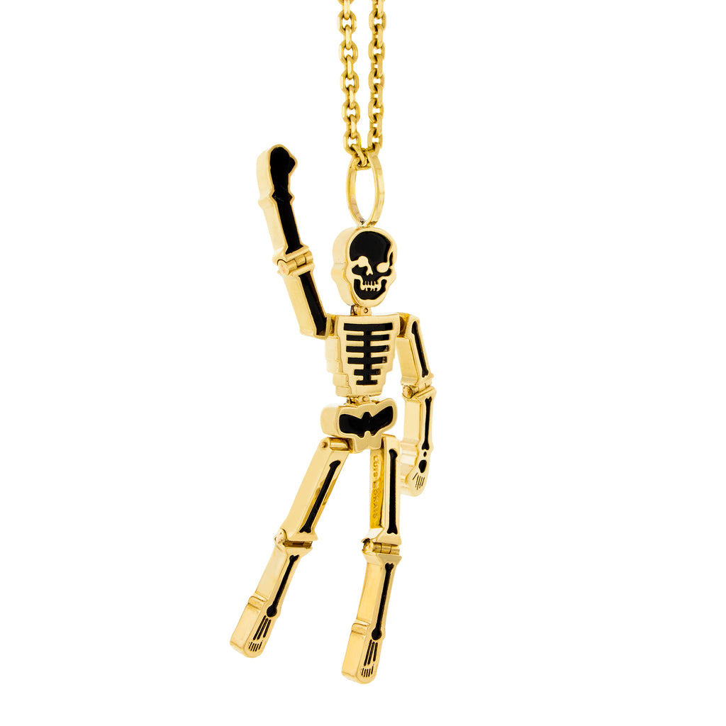 LUIS MORAIS 14K yellow gold articulated skeleton pendant with an onyx gemstone backing
