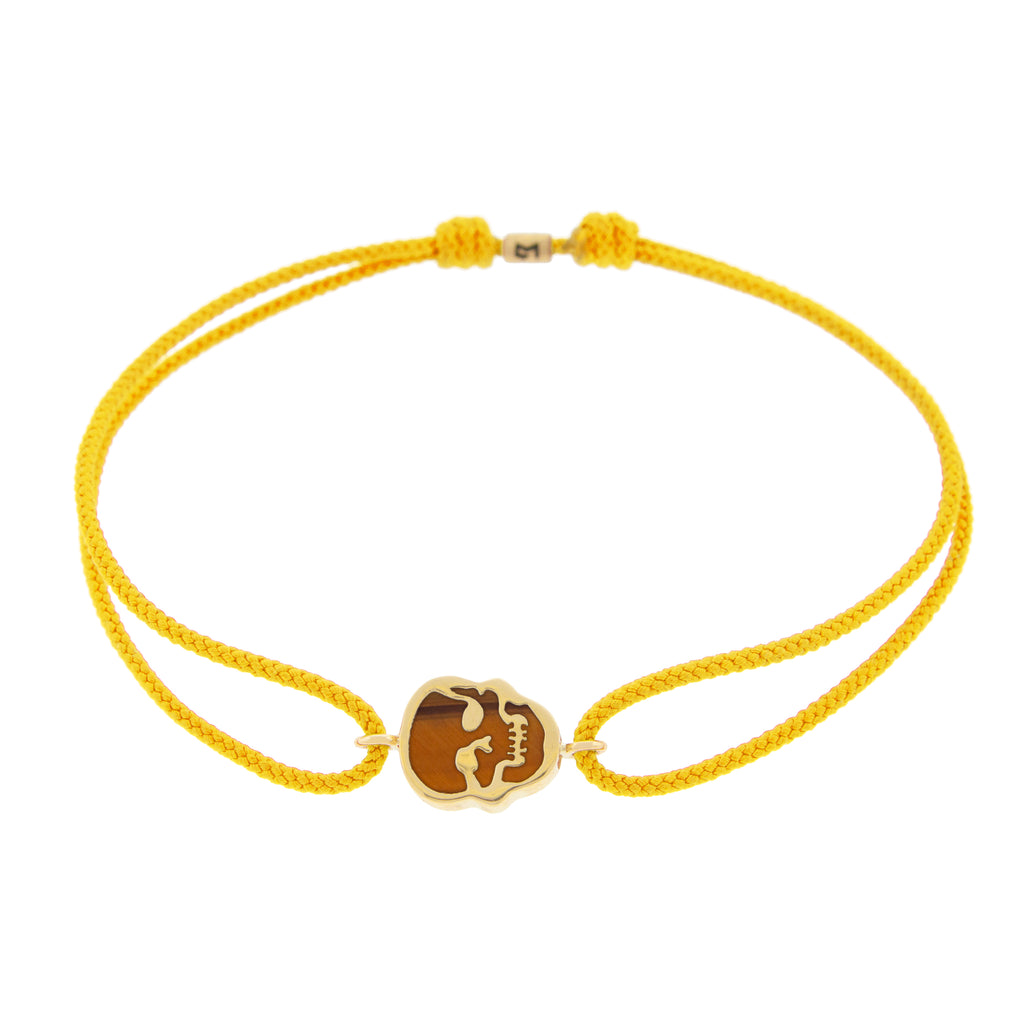 LUIS MORAIS 14K yellow gold 'The Good Times' small skull face medallion with a tiger's eye gemstone backing on yellow cord bracelet