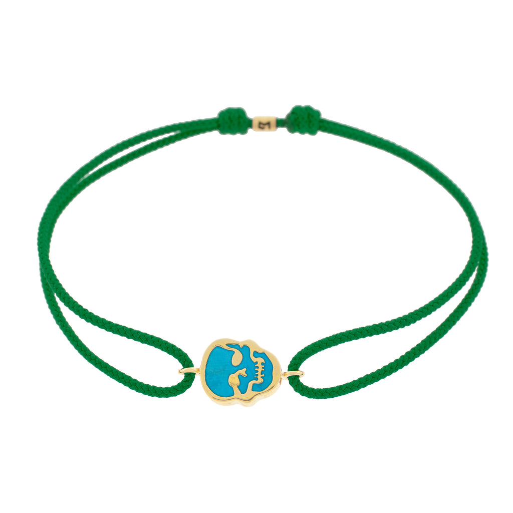 LUIS MORAIS 14K yellow gold 'The Good Times' small skull face medallion with a turquoise gemstone backing on an evergreen cord bracelet